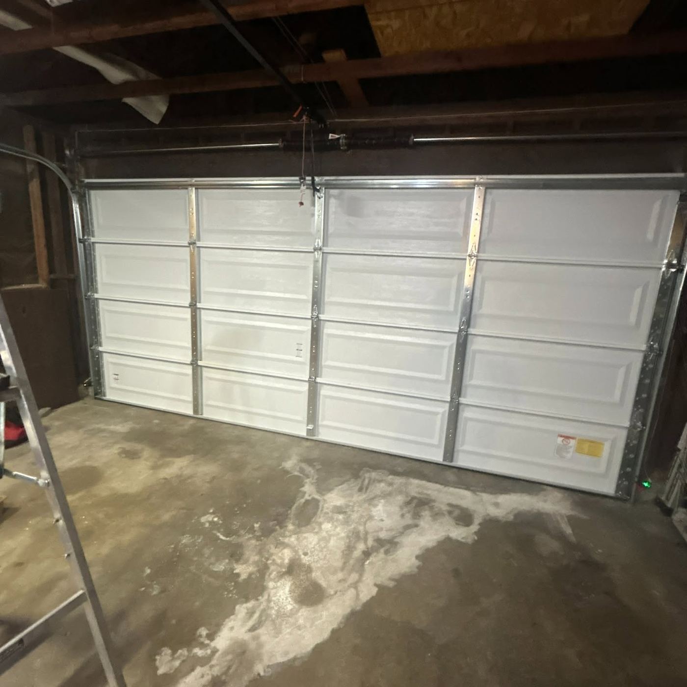 Garage Doors Prime technician completing a new garage door installation