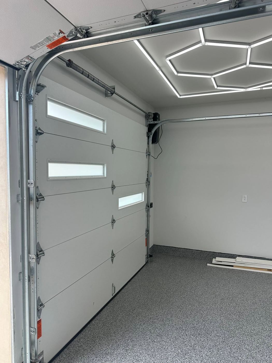 Garage interior with new door and upgraded LED lighting