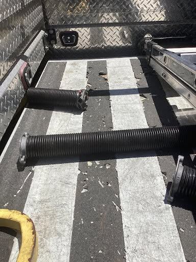 Removed broken springs staged on the service truck