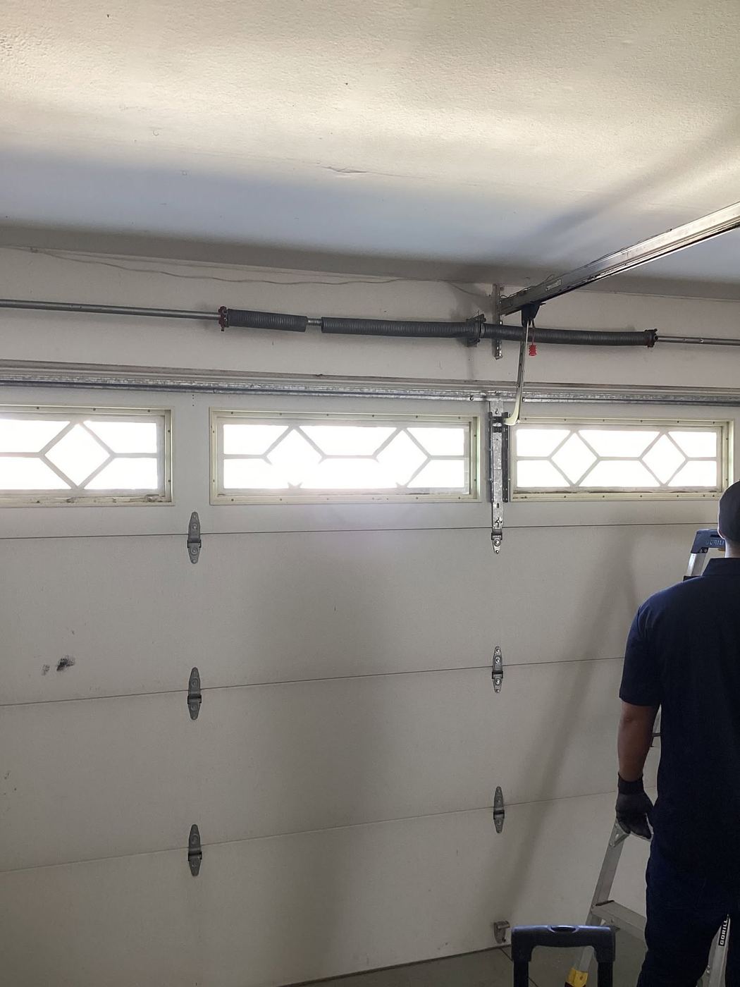 Spring service on a door with diamond window panels